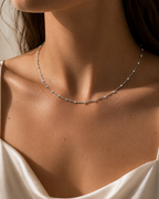 COLLAR RIGIDO ORO BLANCO Y BRILLANTES