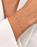 PULSERA ORO ROSA CON PIEDRAS AZULES