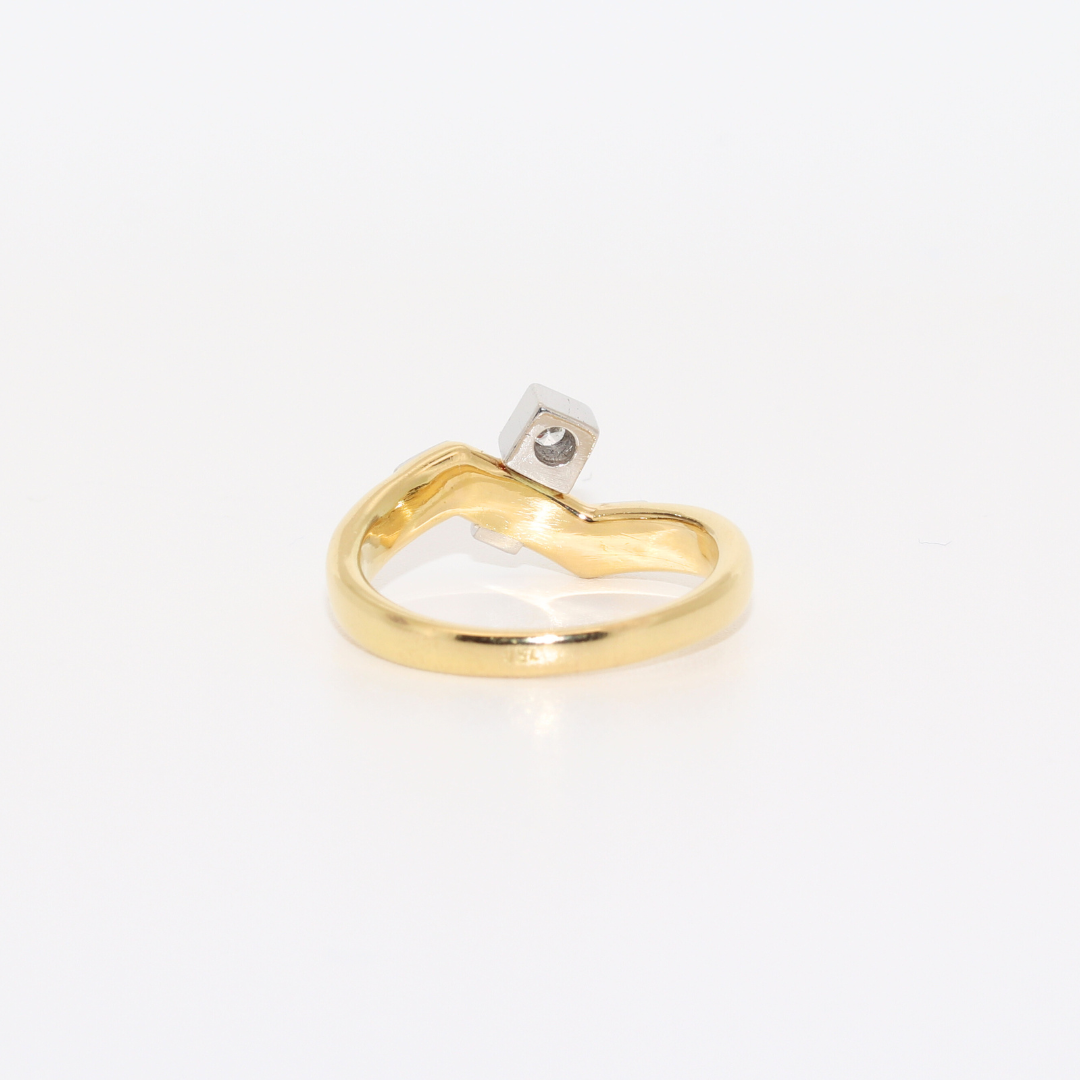 ANILLO BICOLOR CON BRILLANTE