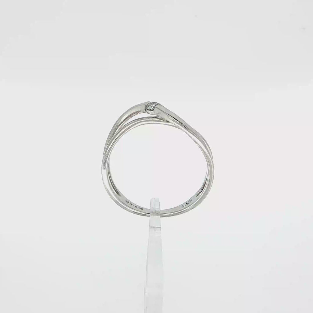 ANILLO ORO BLANCO Y DIAMANTE CRUZADO